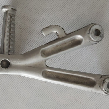 Voetsteun / Footrest hanger rear Lh